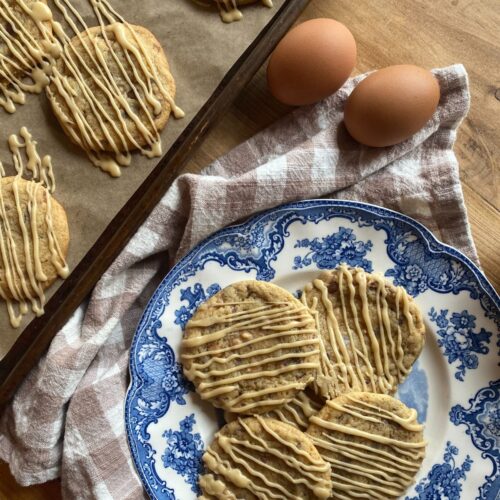 brown sugar and toffee sourdough discard cookies drizzled with icing