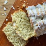 sliced sourdough lemon poppyseed bread drizzled with vanilla icing