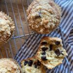 sourdough chocolate chip muffins on a cooling rack