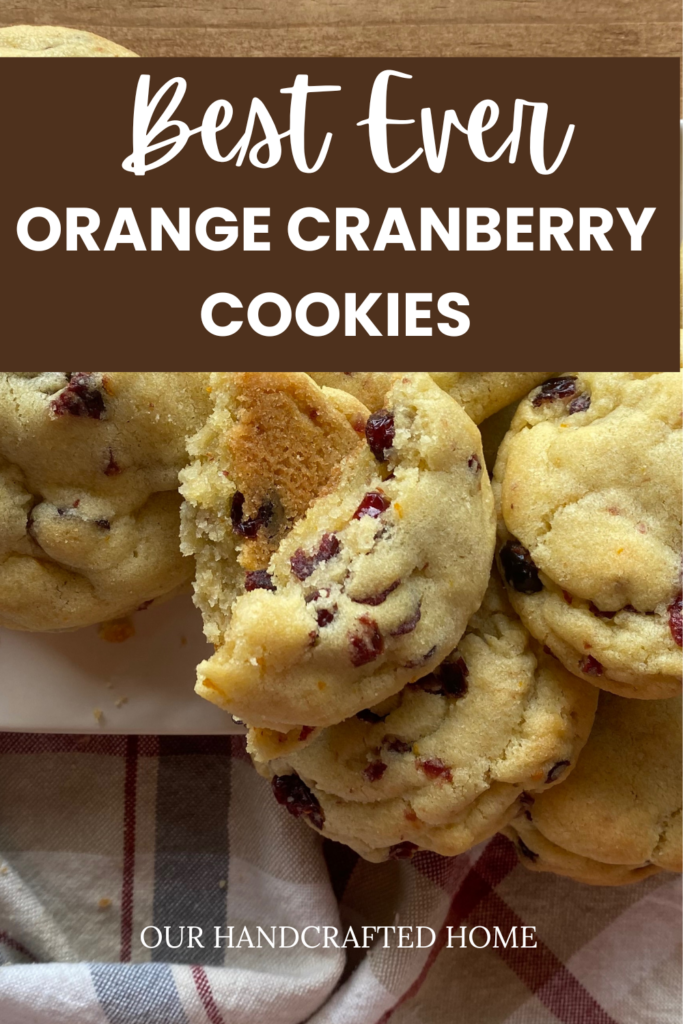 Soft and chewy orange cranberry cookies filled with dried cranberries and orange zest, stacked on a white plate over a rustic wooden table. Text overlay reads "Best Ever Orange Cranberry Cookies"