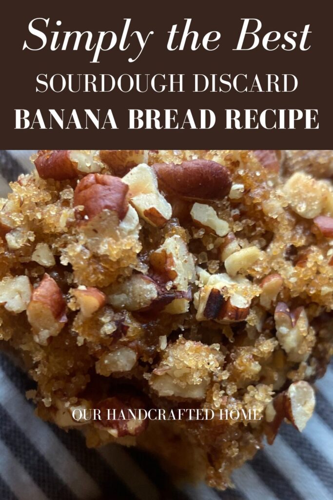 A close of view of a slice of sourdough discard banana bread, sitting on a striped towel. Text overlay reads "Simply the Best Sourdough Discard Banana Bread Recipe"