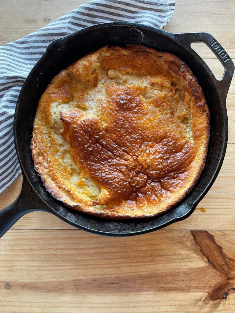 a sourdough Dutch baby pancake, baked until puffed and golden brown on top
