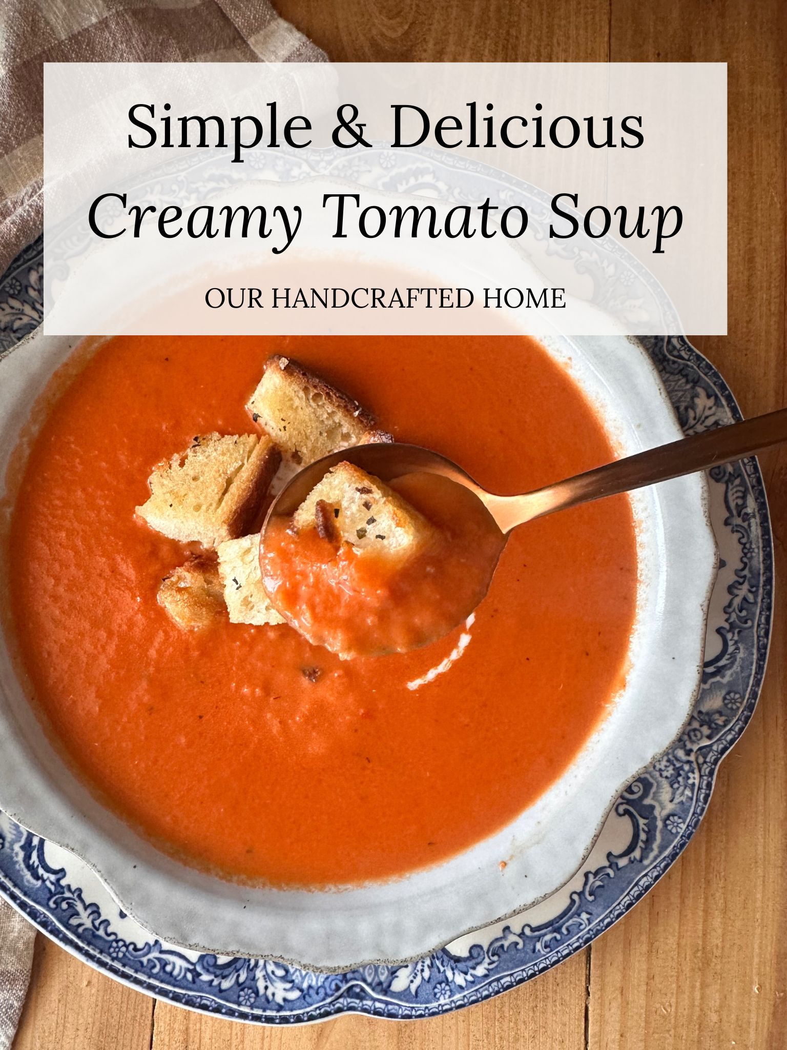 a close up of a bowl of tomato soup, with a spoon dipped into the center. Text overlay reads "Simple & Delicious Creamy Tomato Soup"