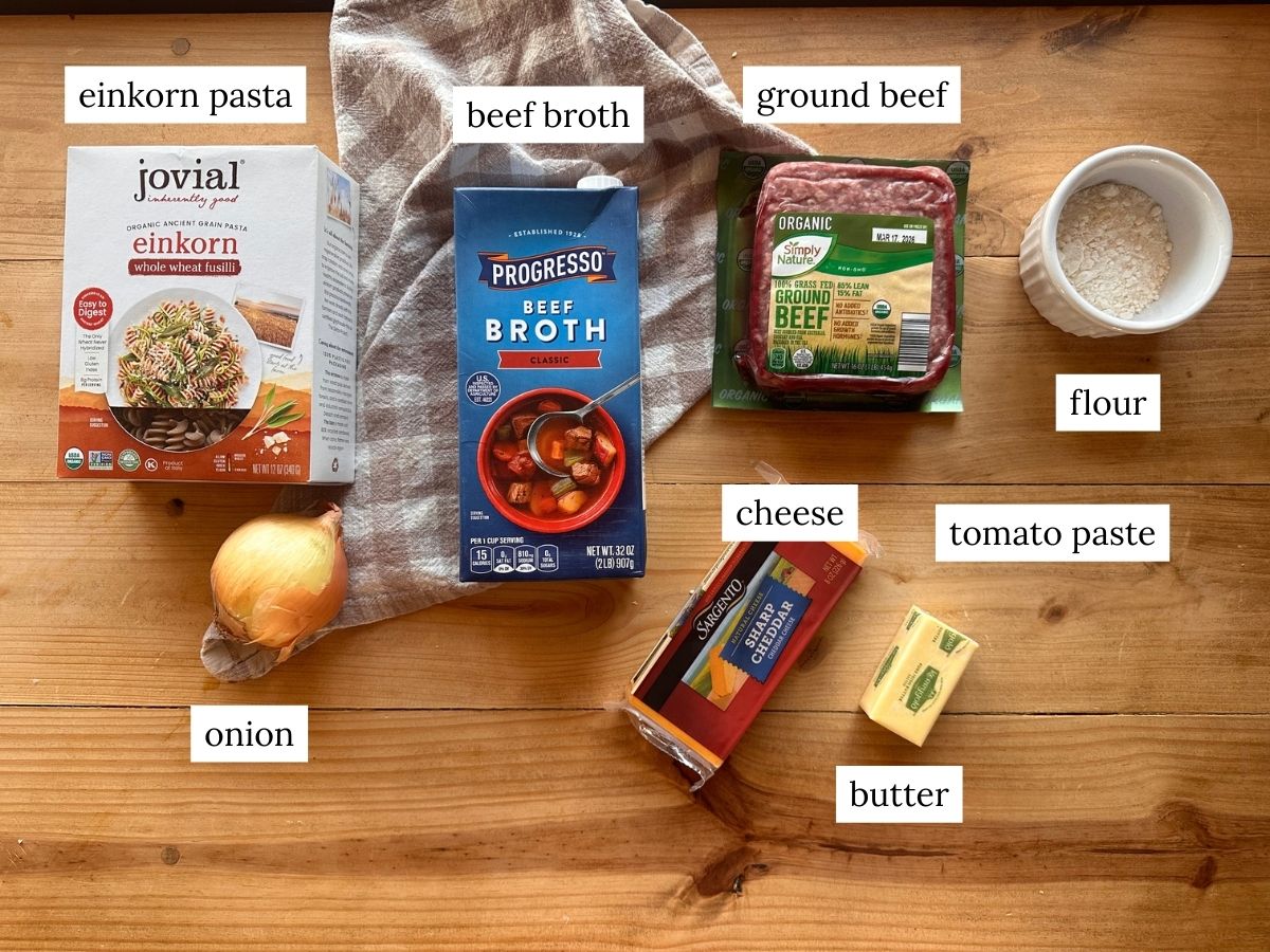 a labeled ingredient photo of ingredients needed to make homemade hamburger helper with einkorn pasta