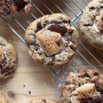 a cookie with a gooey golden brown marshmallow center and chopped melty chocolate on the top