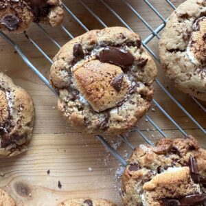 a cookie with a gooey golden brown marshmallow center and chopped melty chocolate on the top