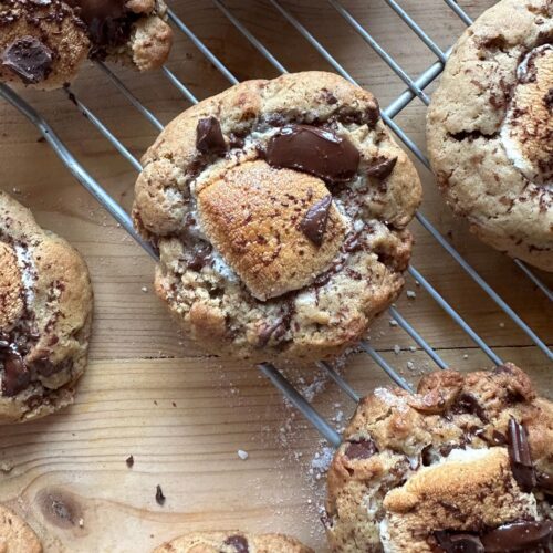 a cookie with a gooey golden brown marshmallow center and chopped melty chocolate on the top