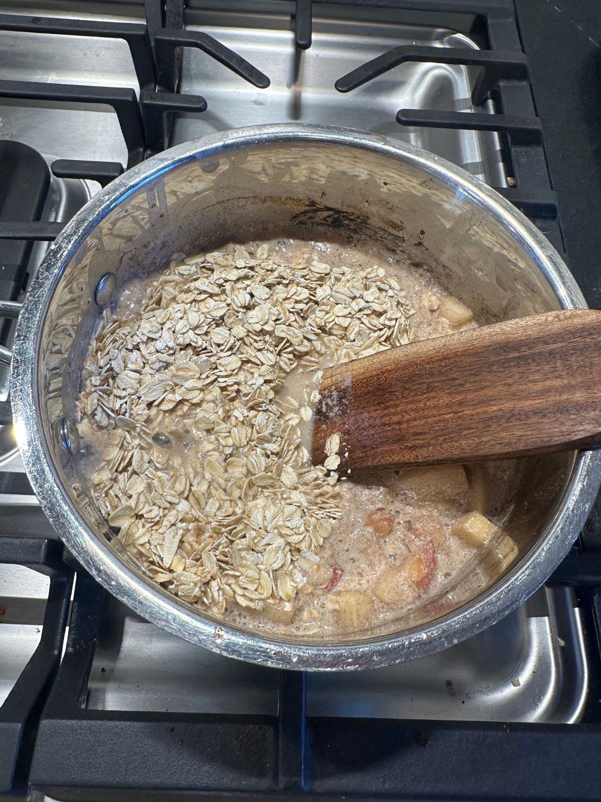 apple pie oatmeal cooking over the stovetop